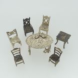 A 19thC Dutch silver miniature Corner Chair, with Shefiield import marks for Samuel Boyce (or