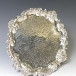 A Victorian silver Salver, hallmarked Newcastle, 1874, makers mark 'I.W', of circular form with