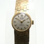 A 9ct yellow gold Record deLuxe lady's Wristwatch, with 17-jewels movement, gold hands and baton