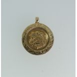 A 9ct gold prize Fob Medallion, with presentation inscription 'Paddock C&B.C Huddersfield & Dist