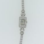 A lady's Art Deco diamond Cocktail Watch, c.1930, the unsigned rectangular dial with Arabic Numerals