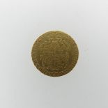 A George III gold Guinea, dated 1775.