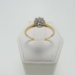 A diamond solitaire Ring, the circular stone approx 0.5ct, claw set in 18ct yellow and white gold on