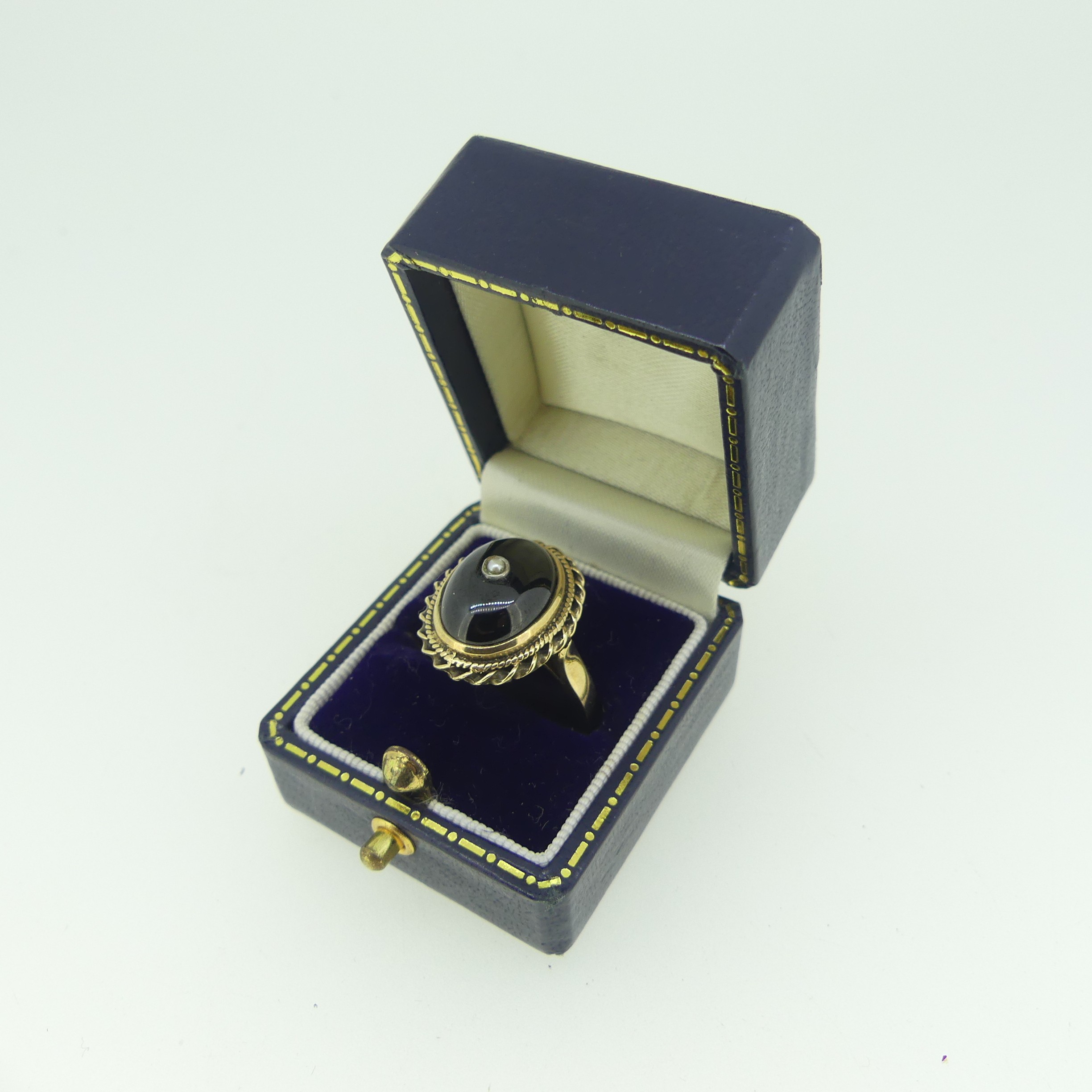 A cabochon garnet Ring, the stone approx. 13.5mm collet set in 9ct gold mount with rope border and - Image 2 of 3