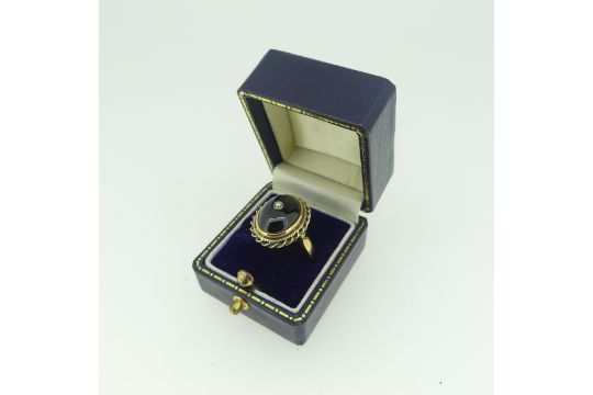 A cabochon garnet Ring, the stone approx. 13.5mm collet set in 9ct gold mount with rope border and - Image 2 of 3