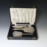 An Elizabeth II cased silver mounted Dressing Table Set, by W G Sothers Ltd., the hand mirror and