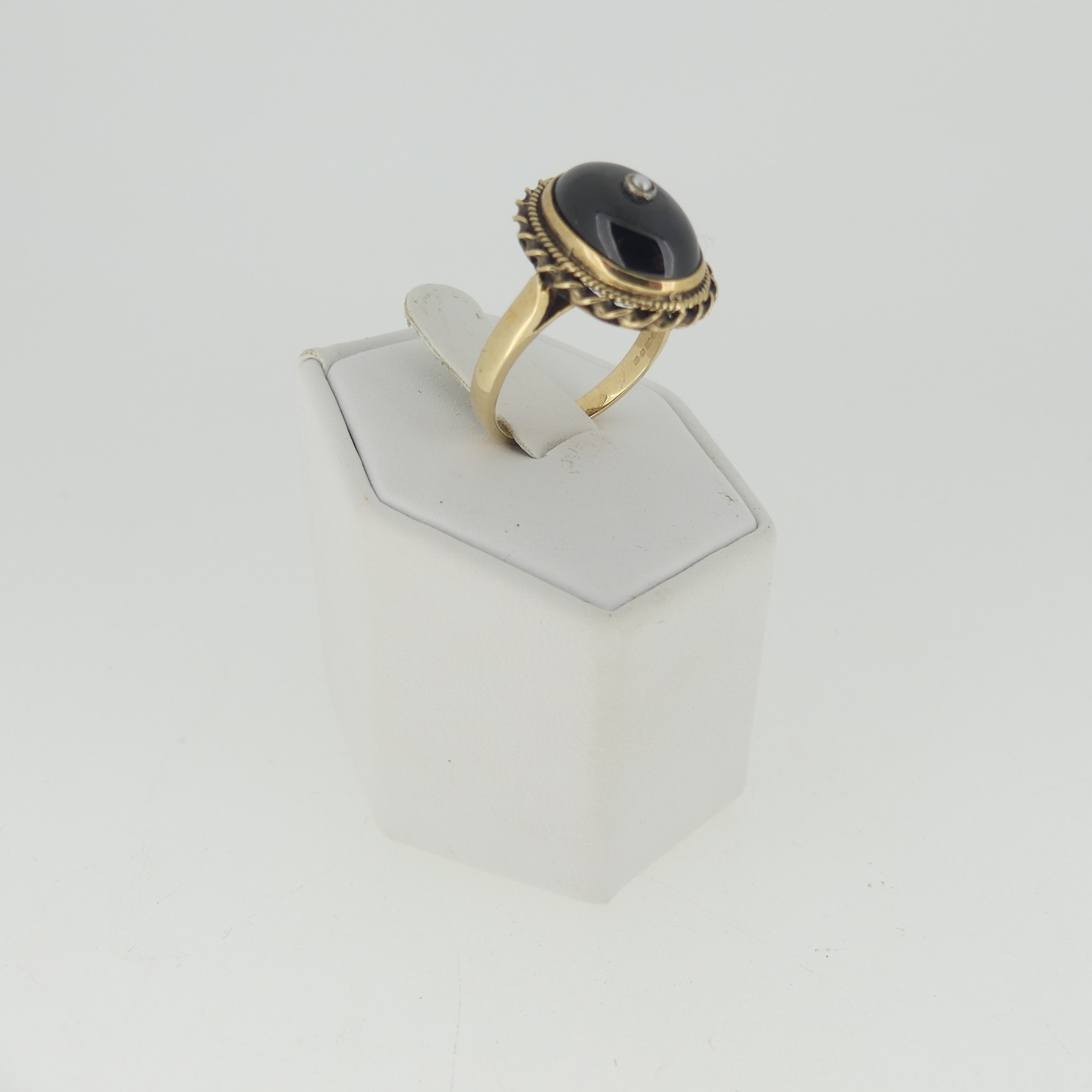 A cabochon garnet Ring, the stone approx. 13.5mm collet set in 9ct gold mount with rope border and - Image 3 of 3