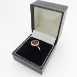 A star ruby and diamond Ring, the oval cabochon ruby, approx 2.7ct (7.6mm x 6.9mm) four claw set