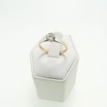 A single stone diamond Ring, approx 0.1ct, illusion set in 18ct yellow gold and platinum, Size Q,