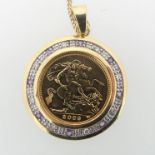 An Elizabeth II gold Half Sovereign, dated 2003, in 9ct gold circular pendant mount set with