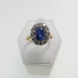 A sapphire and diamond cluster Ring, the oval facetted sapphire c. 2.3ct (8.75mm x 6.5mm x 4.3mm)