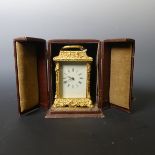 A 20th century English Fema gilt brass Carriage Clock, the white rectangular dial with Roman