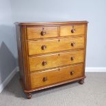 A Victorian mahogany Chest of Drawers, of two short and four long graduating drawers with decorative