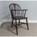 A 19thC elm and yew Windsor Chair, low pierced splat back and yew wood bow, above figured elm saddle