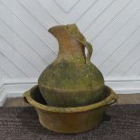 A Large weathered terracotta jug and three handled basin, (Basin) W 54 cm x H 16 cm x D 54 cm, (Jug)