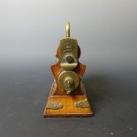 An early 20th century oak Betjemann perfume tantalus of a small size, with key, W: 16.5 cm x H: 18