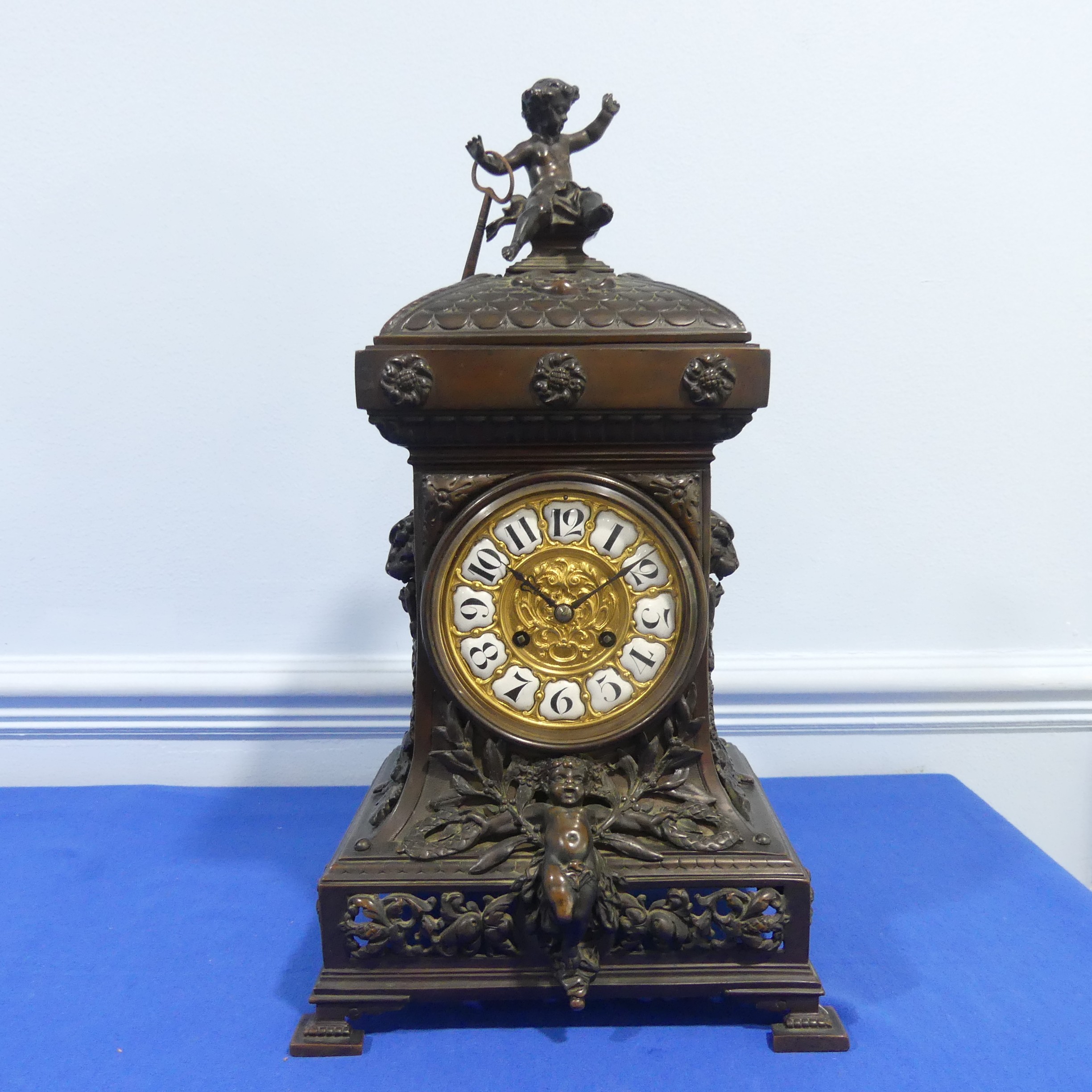A French bronzed-metal Mantel Clock, late 19th century, the architectural case surmounted with an