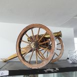 A 20thC decorative Cannon together with approx fourteen more decorative smaller Cannons, W 25.5 cm x