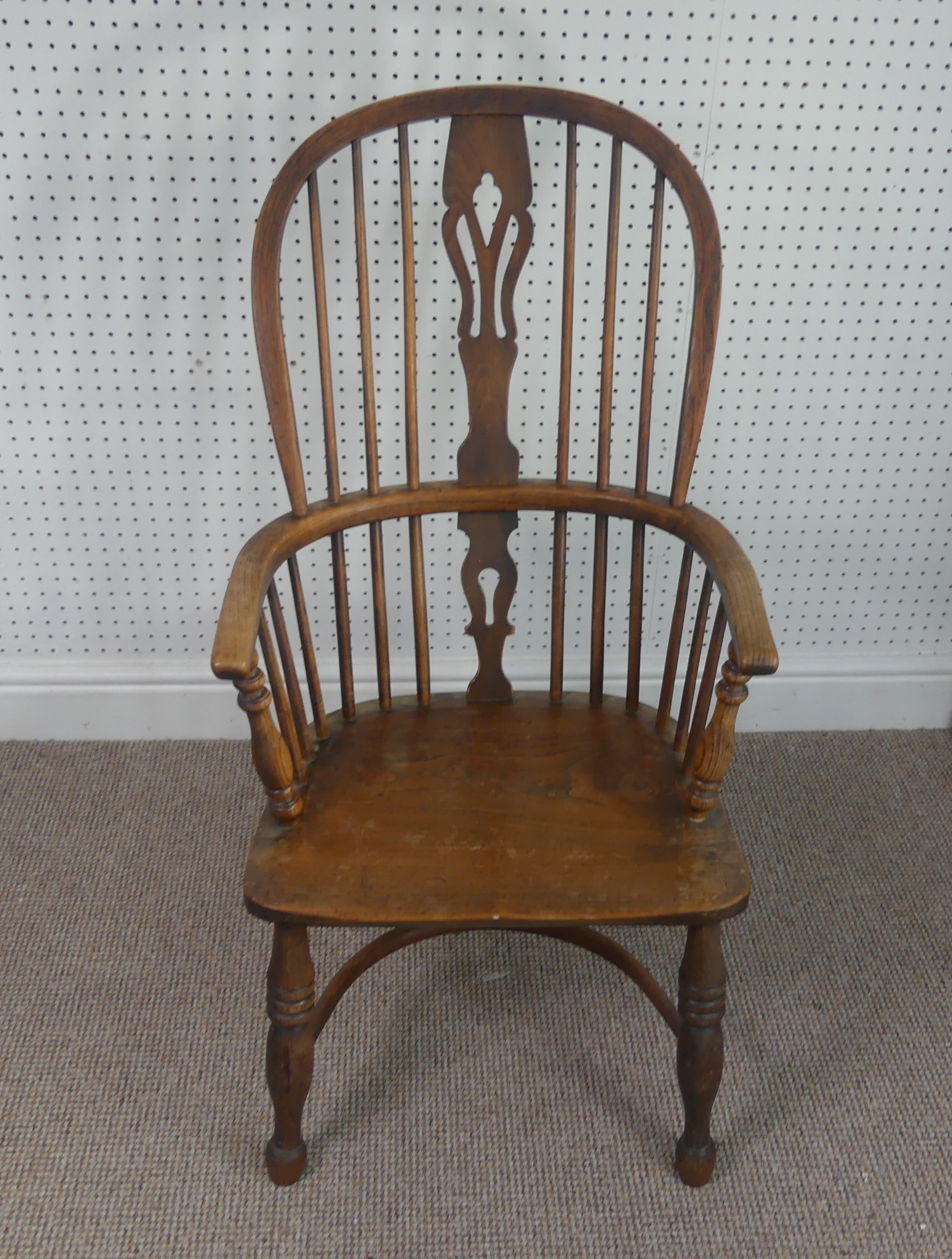 A Late Victorian ash and elm Windsor Chair, stick-back with pierced splat above solid carved base