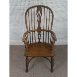 A Late Victorian ash and elm Windsor Chair, stick-back with pierced splat above solid carved base