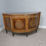 An Edwardian inlaid mahogany serpentine-front Sideboard, with two large cupboard doors, upon small
