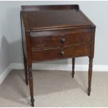 A early 19thC mahogany Clarks Desk, with fall front above two draws supported by four turned legs, W