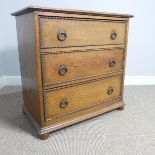 An Early 20th century oak Chest of Drawers, of three long drawers with decorative beading and