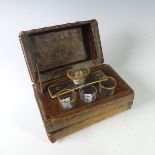 A French 'books' liquor set with one decanter and three glasses, one odd glass see images, within