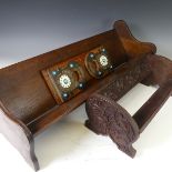 A mahogany Arts and crafts adjustable book rack decorated with brass, 'turquoise' beads and ivorine,