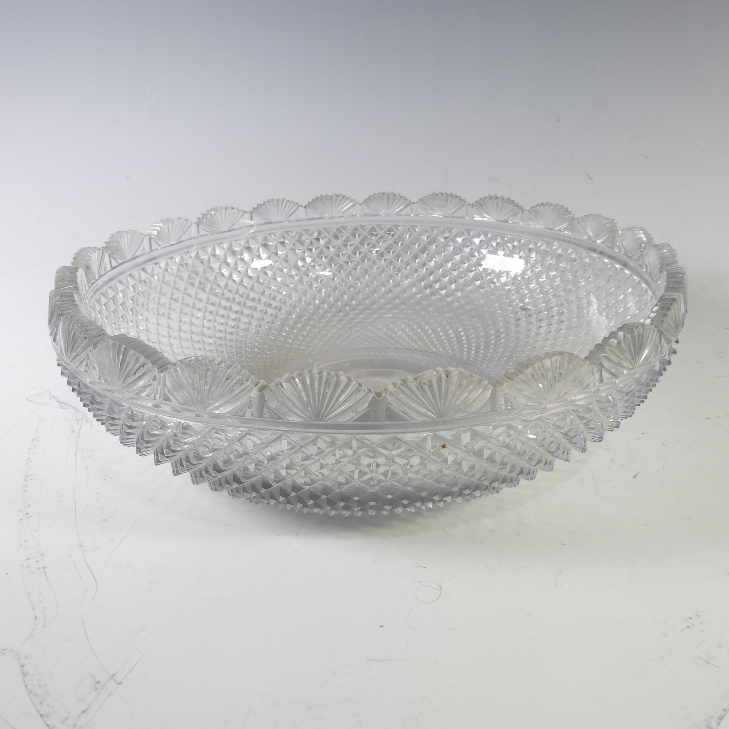 An early 19thC Waterford hand-cut crystal glass Bowl, possibly from the 'Age of Exuberance', the rim