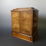 A Victorian walnut travelling Secretaire Cabinet, with inlaid decoration, lockable front panel