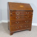 An Edwardian mahogany shell inlaid bureau, of a small size, the fall front, opening to reveal a