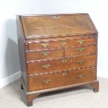 A George III oak Bureau, fall front enclosing a well fitted interior, with graduating drawers