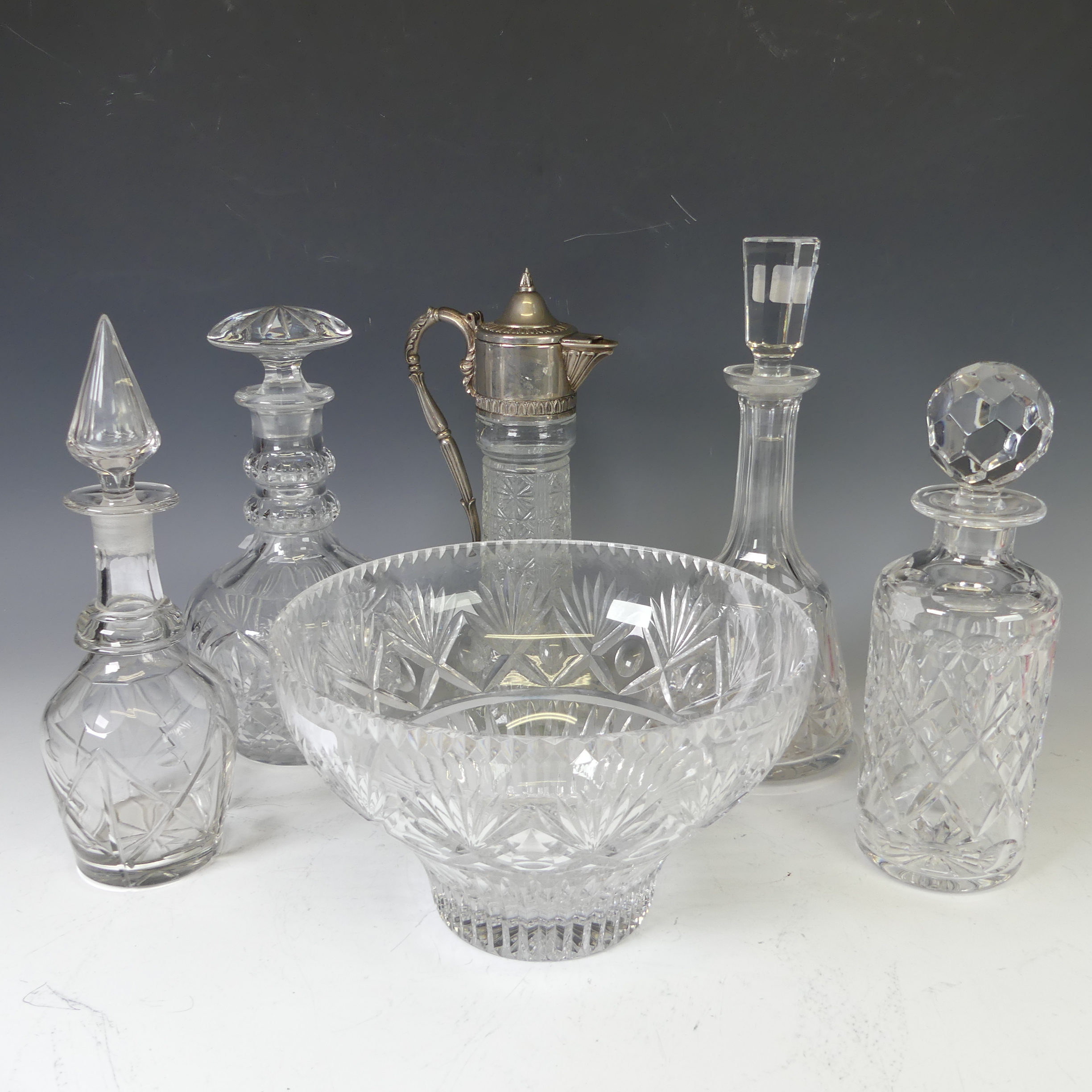A quantity of cut Glass crystal, including four decanters, a fruit bowl and a claret jug (6)