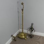 An Arts & Crafts adjustable brass Floor Lamp with three raised hearts to the base supported by three
