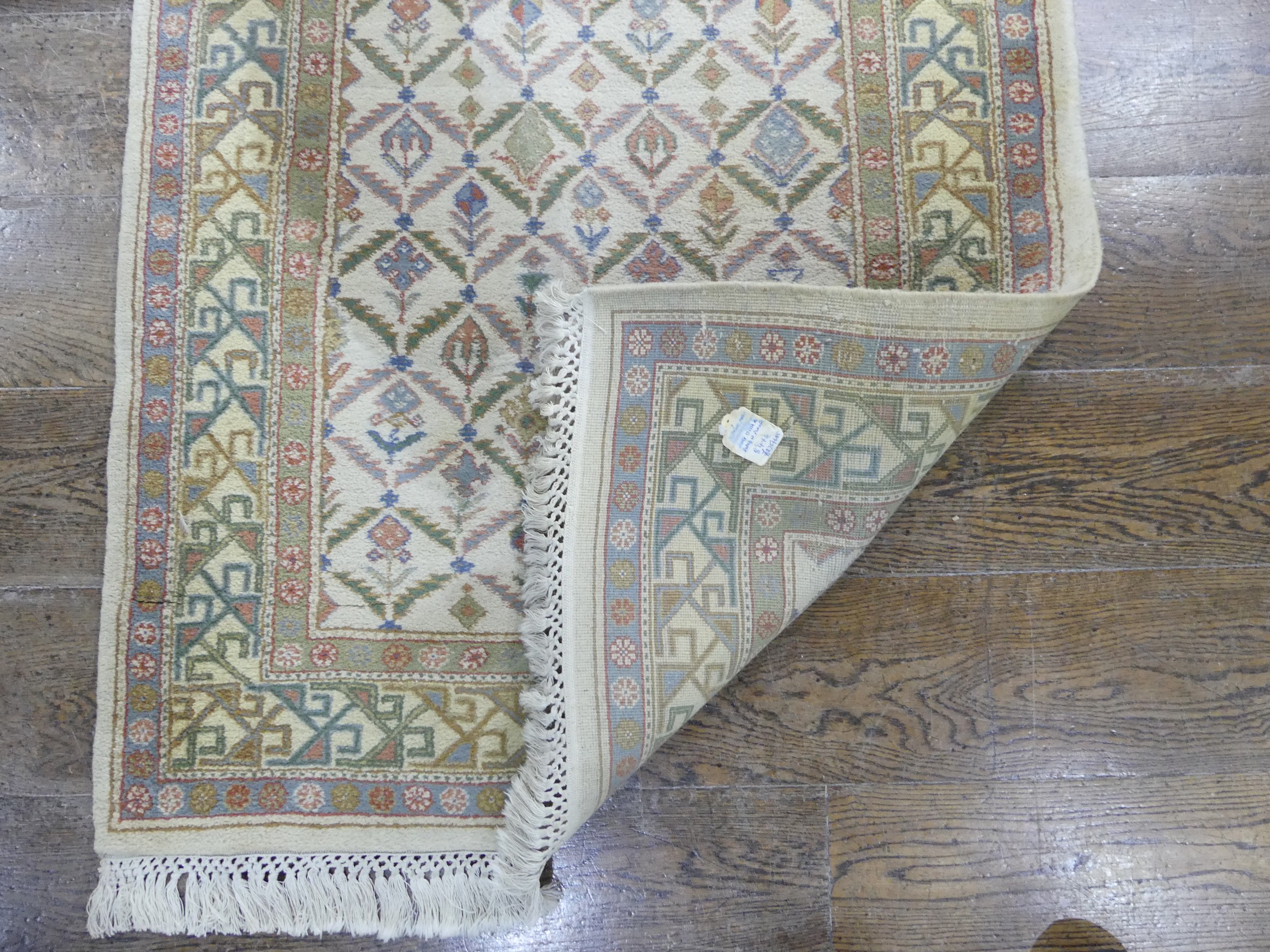 Tribal rugs; a hand-knotted runner, cream ground woven with geometric designs, thick wool pile on - Image 2 of 5
