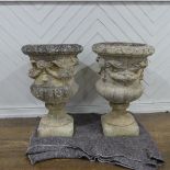 A pair of Reconstituted stone classical Garden Urns with swag decoration raised on base, W 50 cm x H