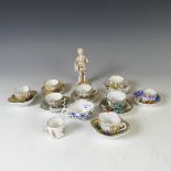 A small quantity of Continental porcelain miniature Teacups and Saucers, each decorated in typical