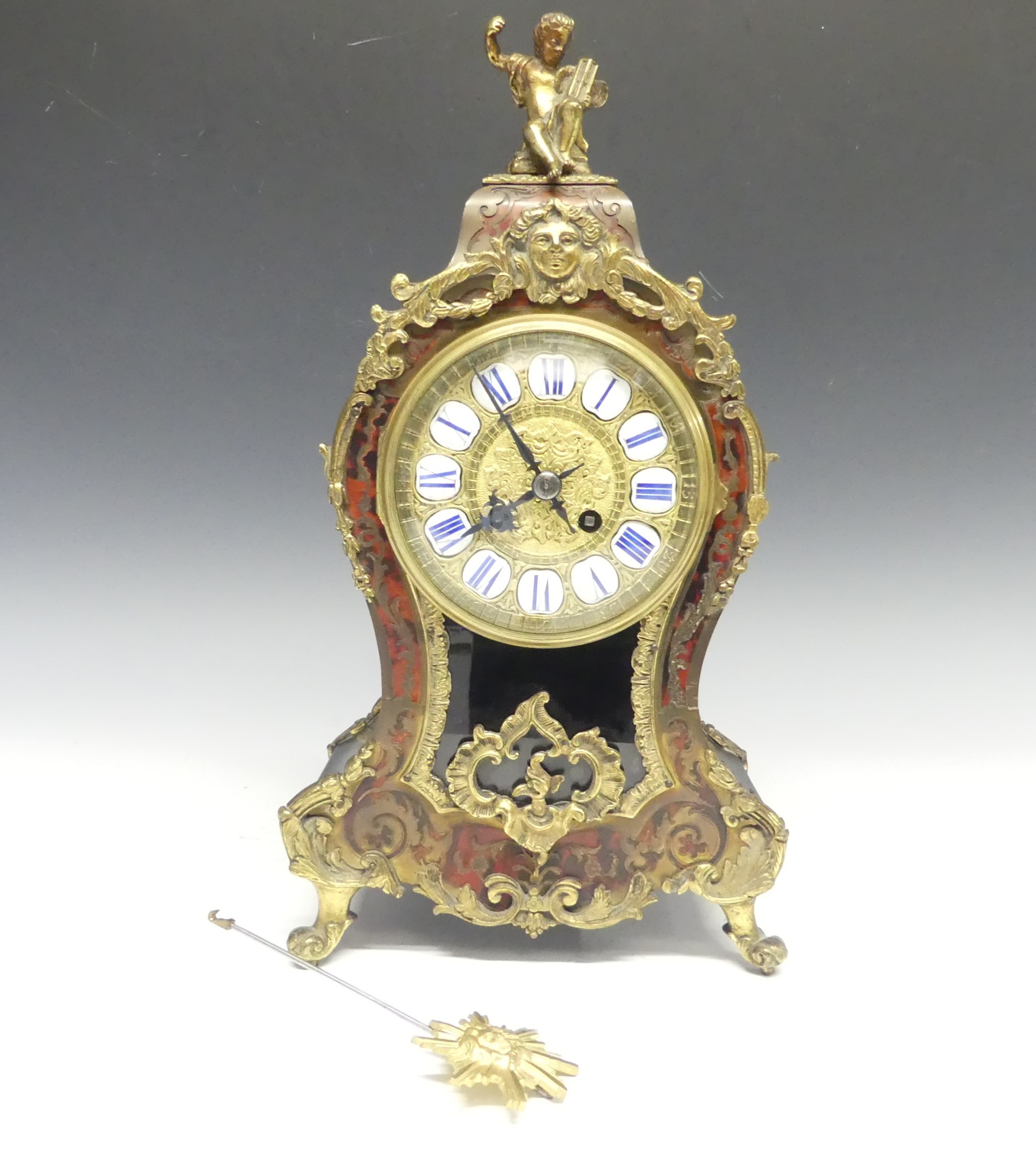 A late 19th century French Boulle work Mantel Clock, the elaborate case with tortoiseshell veneer,