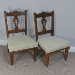 A pair of Edwardian upholstered Parlour Chairs, with carved splat and back decoration, on turned