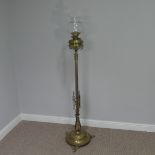 A Late 19thC/Early 20thC Brass standard Oil Lamp, with decorative reeded column, brass font and