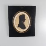 Attributed to William Alport (fl. 1830), Silhouette portrait of a young man profile to sinister,