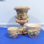 A 20thC Capodimonte majolica Urn, with decoration in relief, H 43cm, together with two