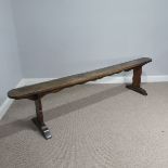 An antique oak and elm form, W 204 cm x H 48 cm x D 41 cm.