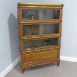 A early 20thC Globe Wernicke oak Stacking Bookcase, three glazed sliding sections above single