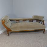 An Edwardian mahogany Chaise Lounge, with carved back panel and open supports, upholstered in a