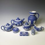 A Wedgwood dark blue Jasperware part Tea Service, including two Teapots, Sucrier, Cream Jug,
