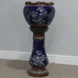 A Doulton Lambeth stoneware Jardinière, with stand, with dark blue ground and tubelined foliate