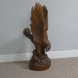 A 20th Century carved wood Bavarian style Eagle, W 20 cm x H 79 cm x D 35 cm.