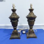 A pair of early 20th century bronzed metal Table Lamps, in the form of classical urn-shaped vases,